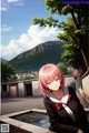 A girl with pink hair sitting on a ledge next to a fountain.